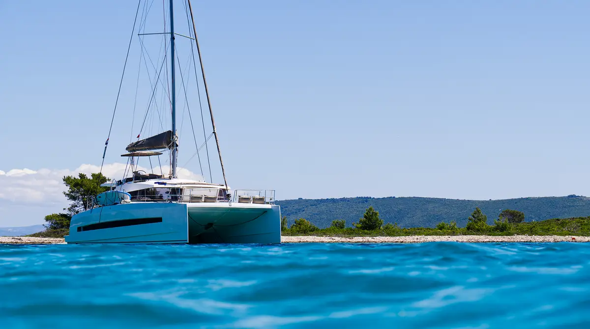 Catamaran sailing on turquoise Caribbean water near Punta Cana, Dominican Republic